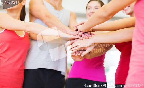 Image of happy people in the gym celebrating victory