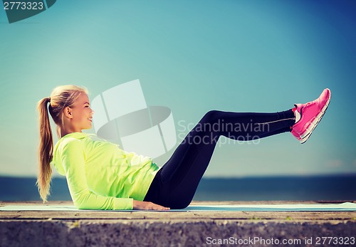 Image of woman doing sports outdoors