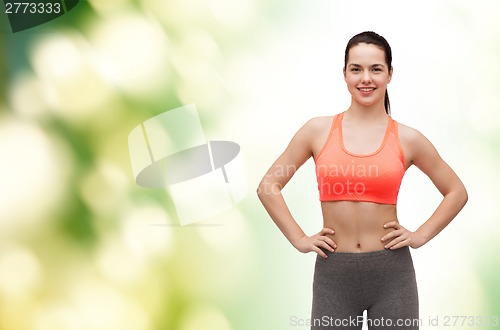 Image of smiling teenage girl in sportswear