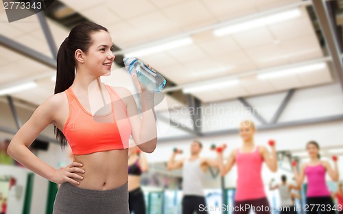 Image of sporty woman with water bottle