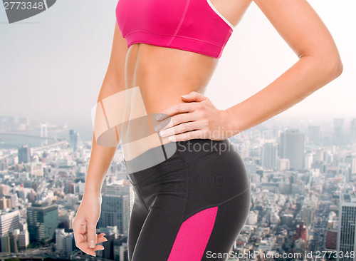 Image of close up of female abs in sportswear