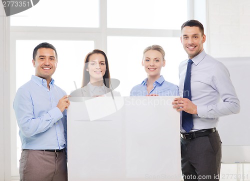 Image of business team in office with white blank board