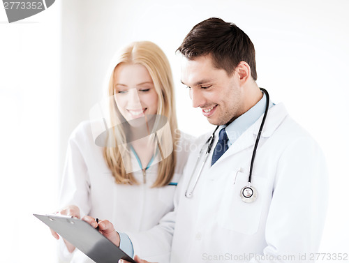 Image of two doctors writing prescription