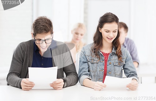 Image of two teenagers looking at test or exam results