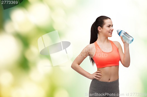 Image of sporty woman with water bottle