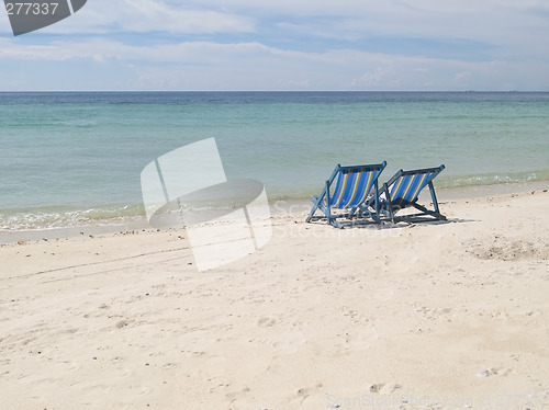 Image of Two chairs on the beach