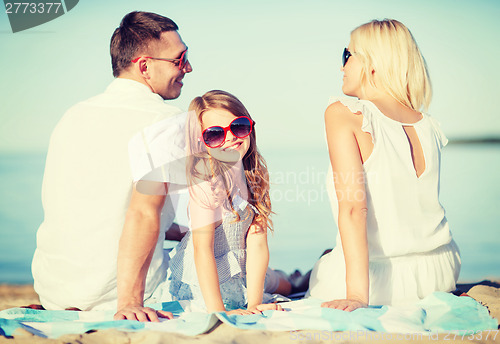 Image of happy family on the beach