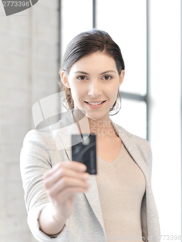 Image of happy woman with credit card