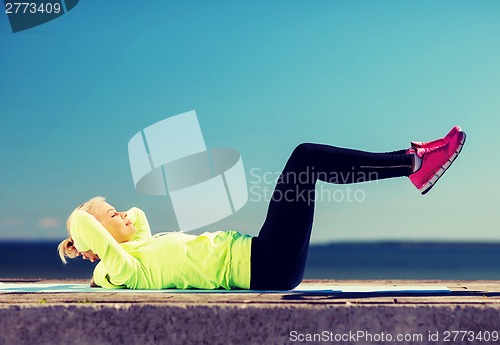 Image of woman doing sports outdoors