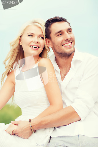 Image of couple in shades at sea side