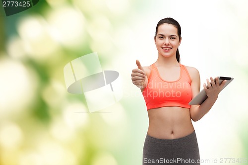 Image of sporty woman with tablet pc computer