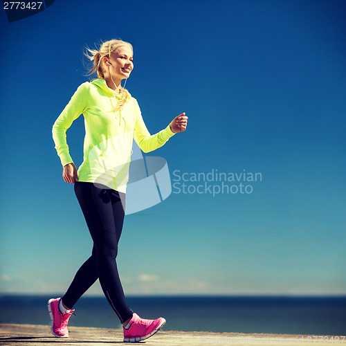 Image of woman doing sports outdoors