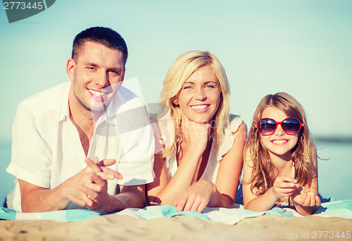 Image of happy family on the beach