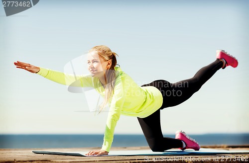 Image of woman doing sports outdoors