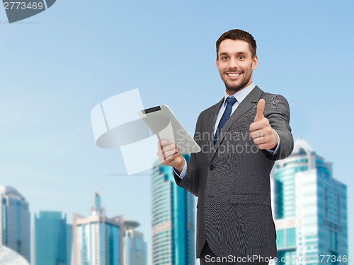 Image of smiling buisnessman with tablet pc computer