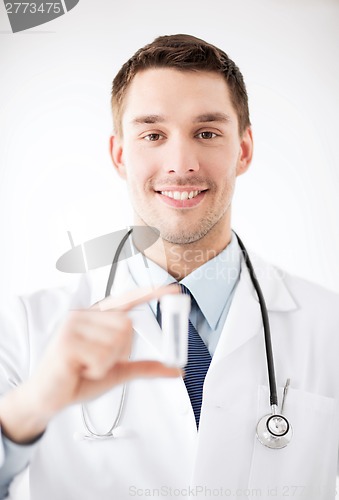 Image of young male doctor with empty test-tube