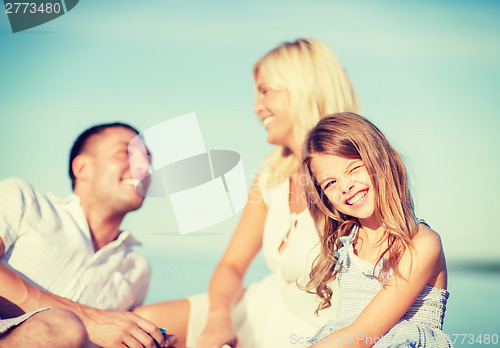 Image of happy family having a picnic