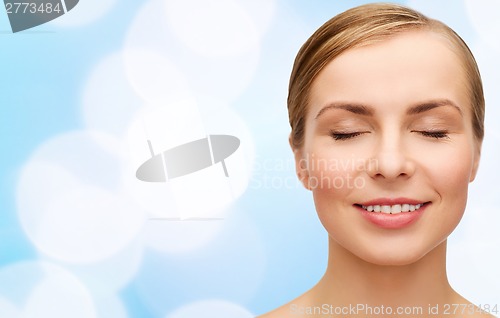 Image of face of beautiful woman with closed eyes