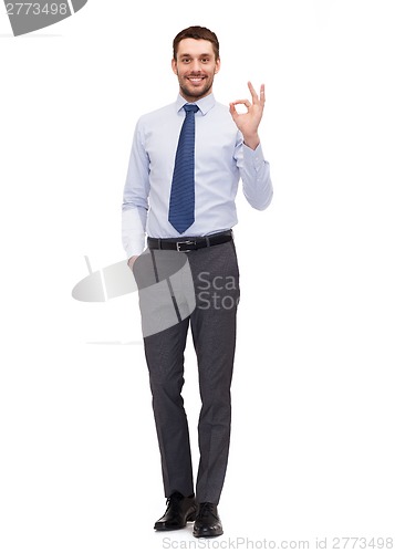 Image of handsome businessman showing ok-sing