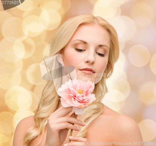 Image of lovely woman with peony flower