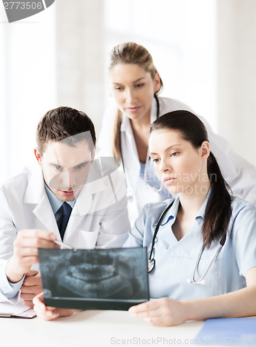Image of group of doctors looking at x-ray