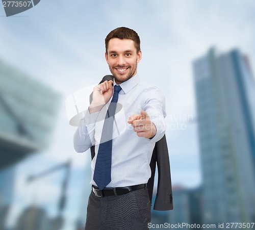 Image of handsome buisnessman with jacket over shoulder