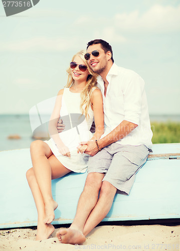 Image of couple in shades at sea side