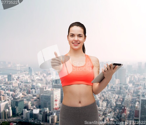 Image of sporty woman with tablet pc computer