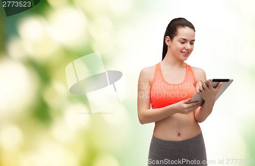 Image of sporty woman with tablet pc computer