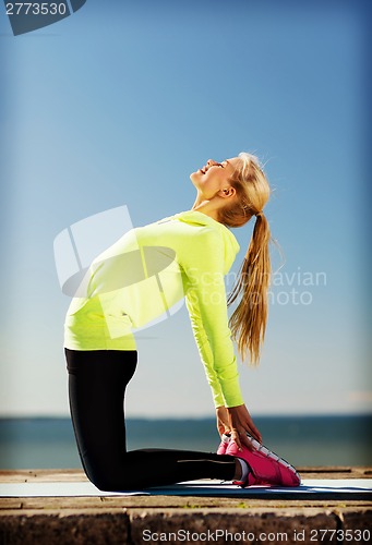 Image of woman doing sports outdoors