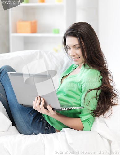 Image of happy woman with laptop computer