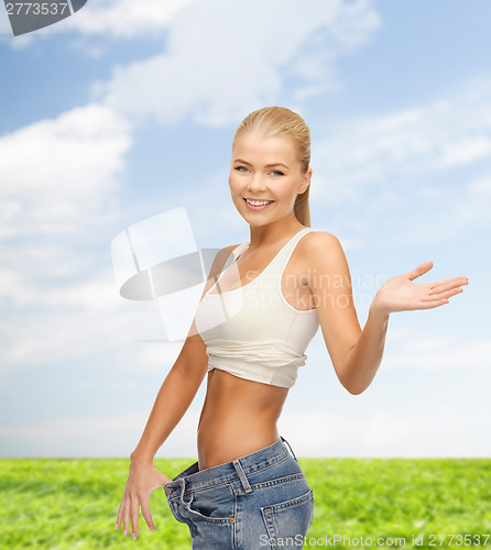 Image of sporty woman showing big pants