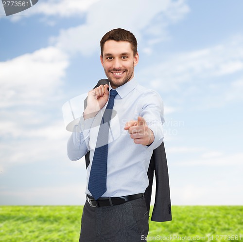 Image of handsome buisnessman with jacket over shoulder