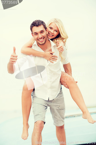 Image of couple having fun on the beach