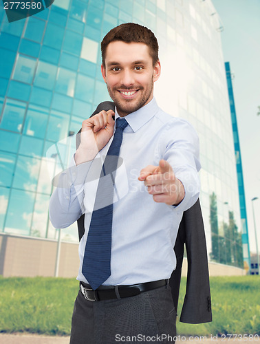 Image of handsome buisnessman with jacket over shoulder