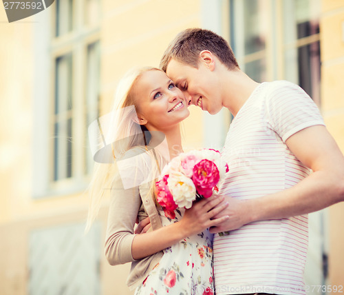 Image of couple with flowers in the city