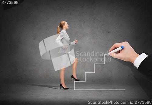 Image of smiling businesswoman stepping up staircase