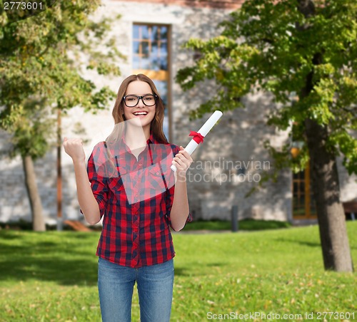 Image of smiling female student in eyeglasses with diploma