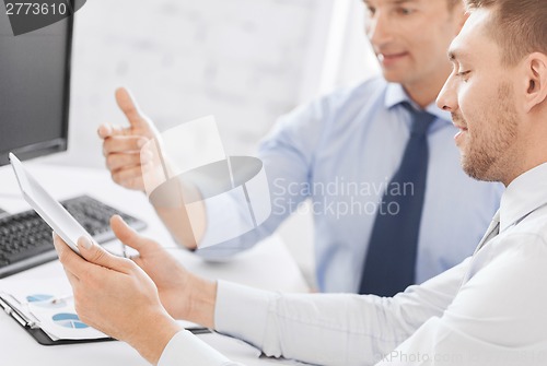 Image of businessmen with notebook and tablet pc