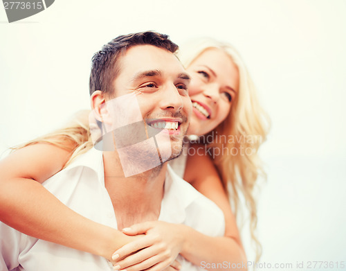 Image of couple having fun on the beach