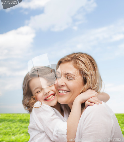 Image of happy mother and daughter hugging