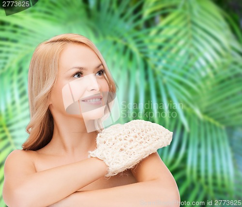 Image of smiling woman with exfoliation glove