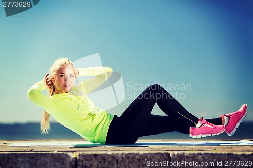 Image of woman doing sports outdoors