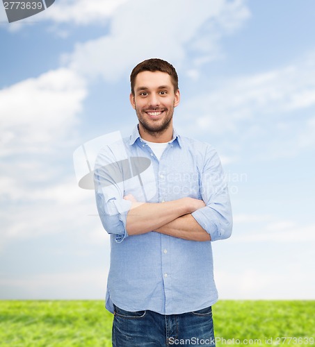 Image of smiling man with crossed arms