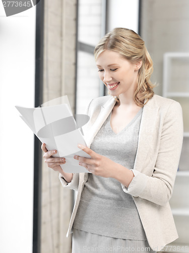 Image of happy woman with documents