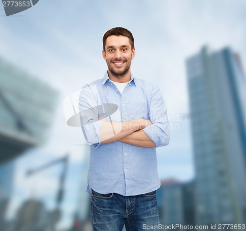 Image of smiling man with crossed arms