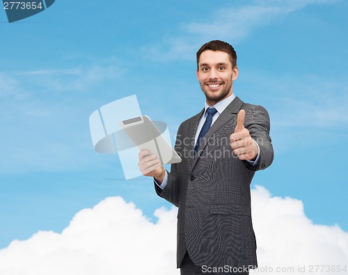 Image of smiling businessman with tablet pc computer