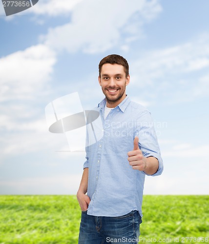 Image of smiling man showing thumbs up
