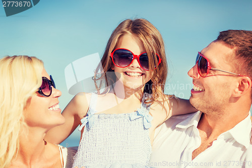 Image of happy family with blue sky