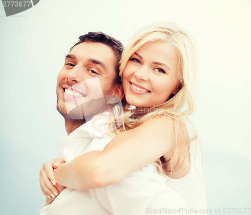 Image of couple having fun on the beach